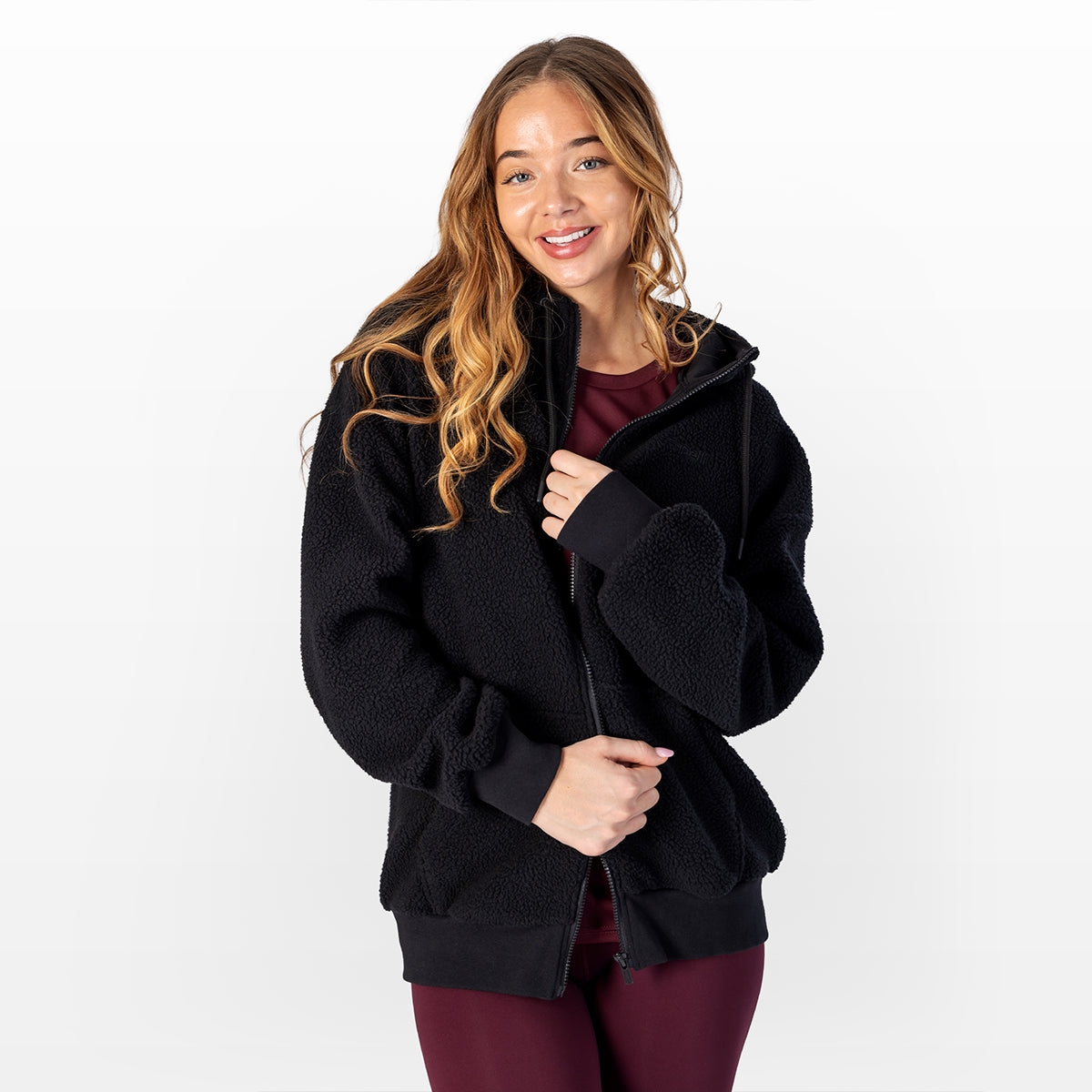 Women's black sherpa zip-up hoodie with zip front and side pockets