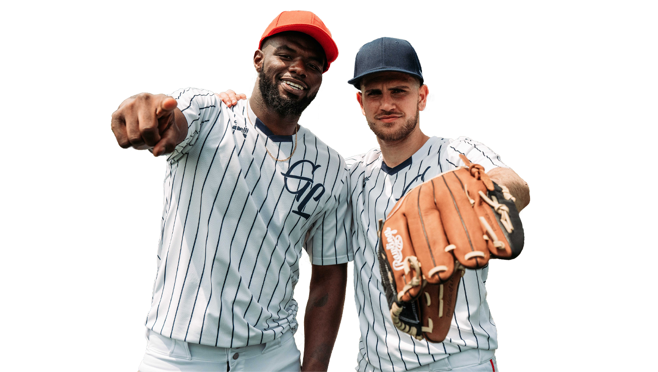 Two men in baseball uniforms posing for a photo on a white background