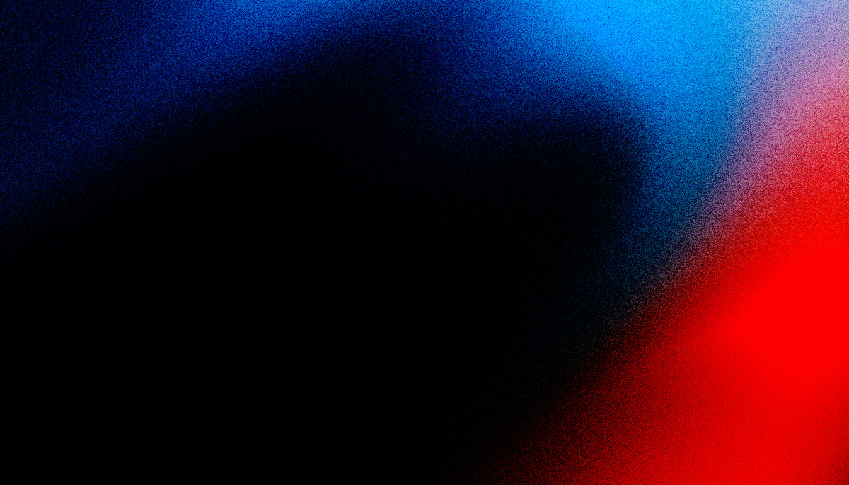 Abstract gradient background with a large black shape overlaid, transitioning into blue at the top and bright red at the lower right.