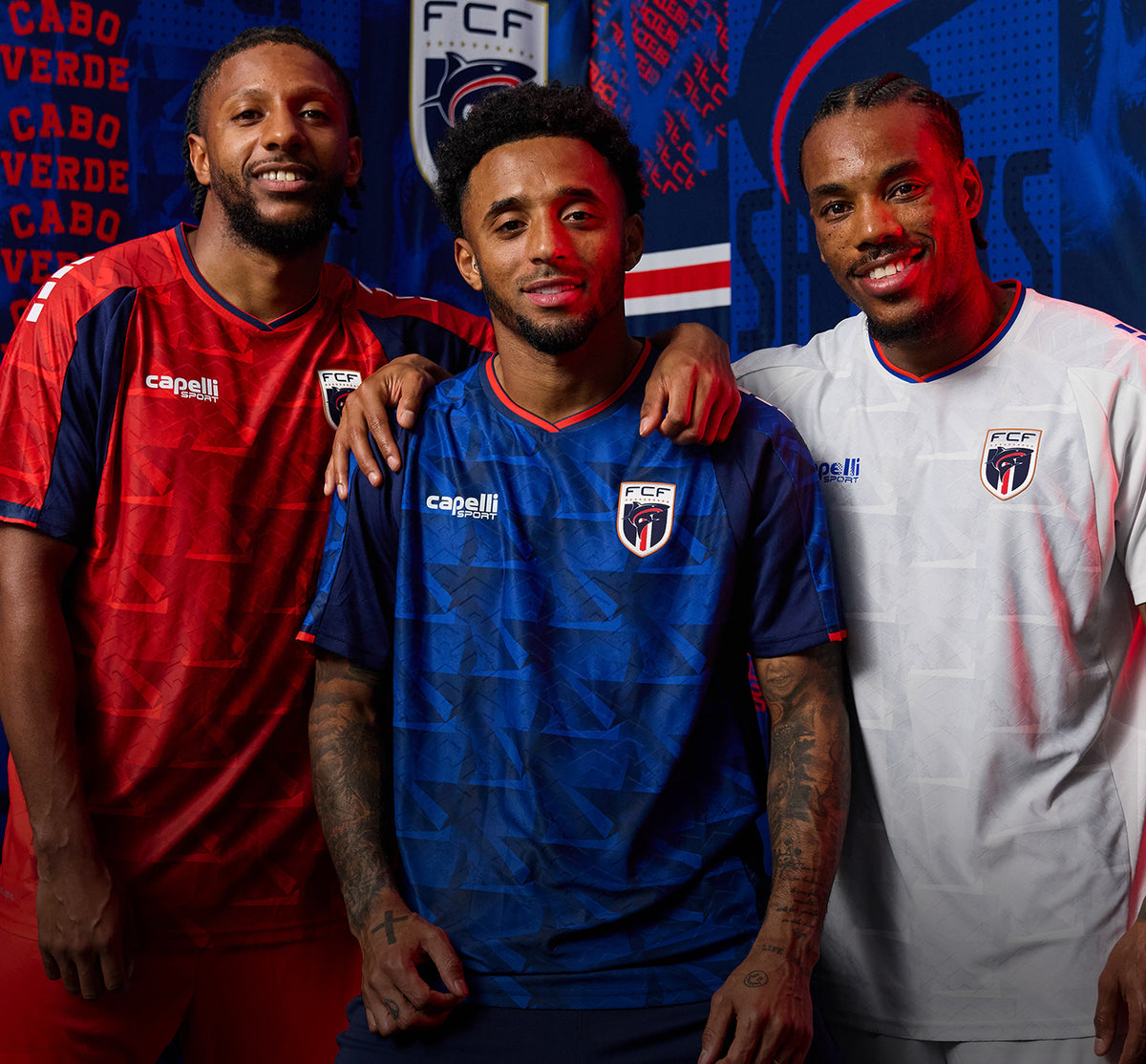 Three Cabo Verde Soccer Players wearing the Capelli Sport x Cabo Verde jerseys.