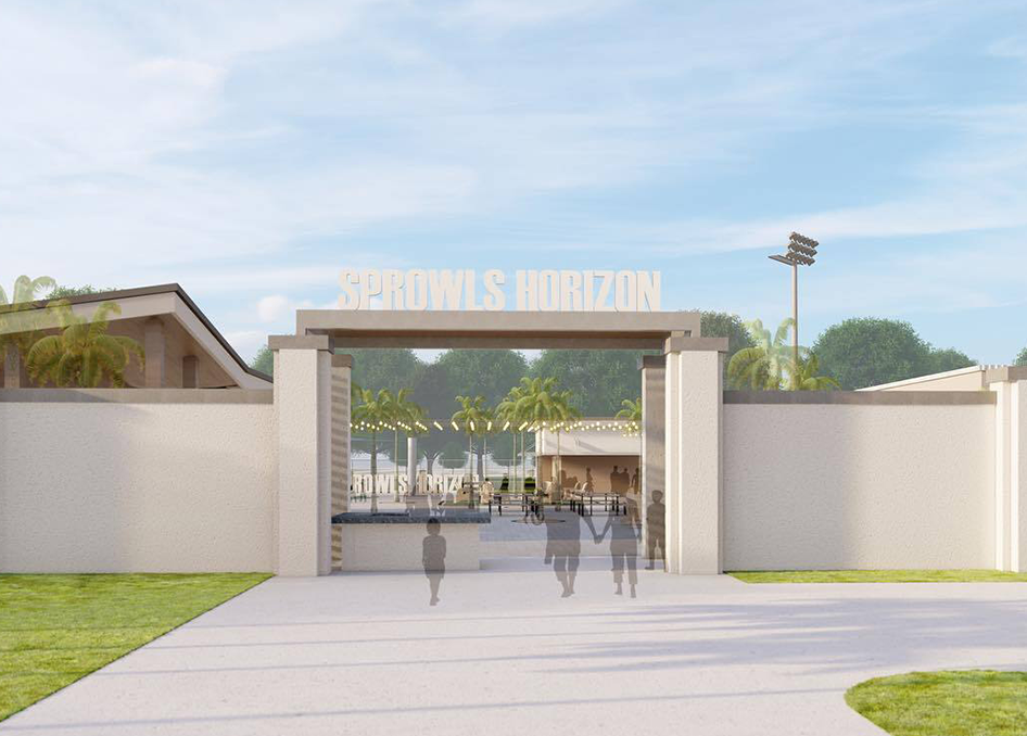 Entrance to 'Schools Horizon' with people walking towards it on a clear day.
