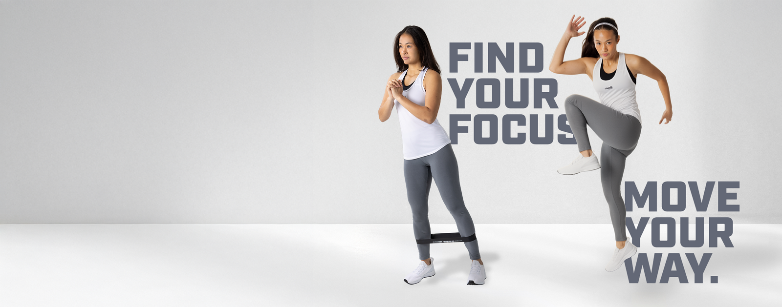 Two women in athletic wear posing with text 'Find Your Focus, Move Your Way' on a gray background