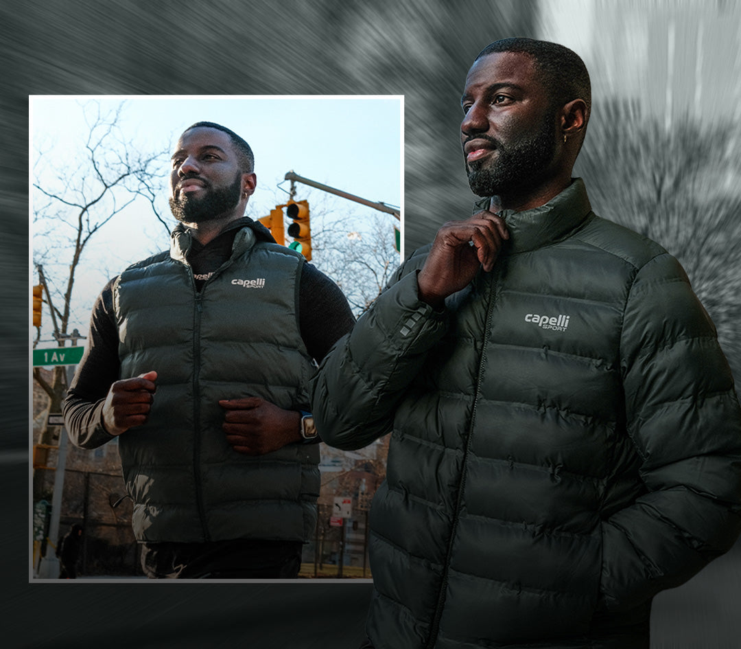 Man wearing a dark green puffer jacket with 'capelli' branding, standing outdoors.