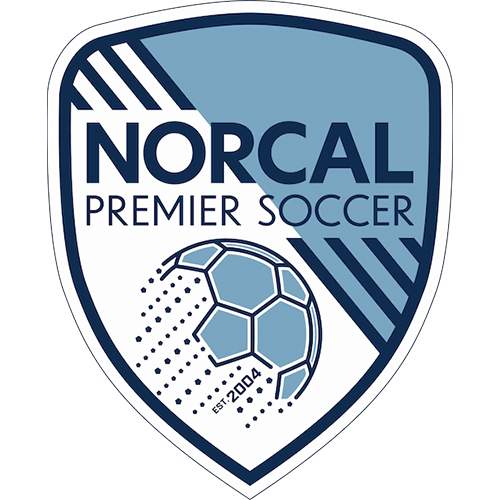 A shield-shaped logo for Norcal Premier Soccer, featuring a stylized soccer ball and text on a white background with blue and navy graphic elements.