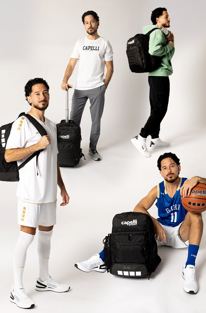 Four men posing with sports bags and equipment on a white background